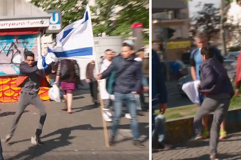 Молодой человек вырвал флаг Израиля у участников пикета и быстро ретировался.