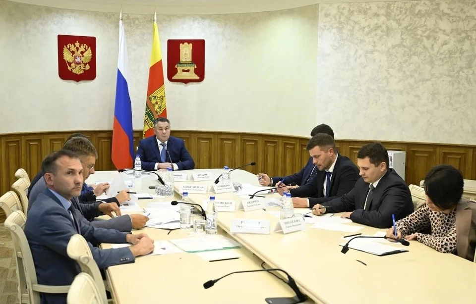 На совещании.