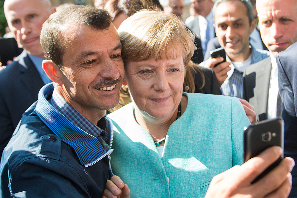 Ангела Меркель в центре приема беженцев из стран Ближнего востока, 2015 год.